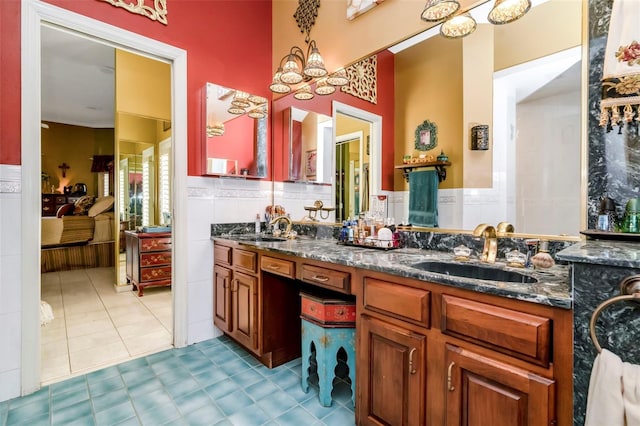 bathroom with tile patterned floors and vanity