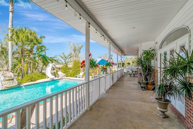 view of patio / terrace featuring a fenced in pool