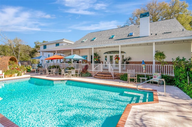 view of swimming pool featuring a patio area