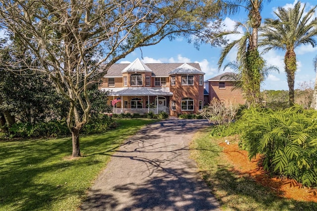 view of front of home with a front lawn and a porch