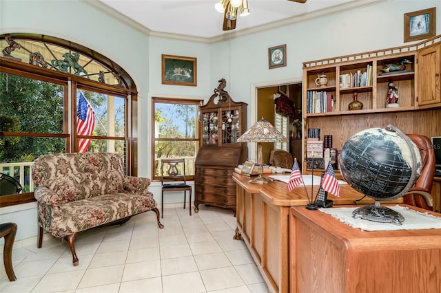 office space with ceiling fan, light tile patterned flooring, and ornamental molding