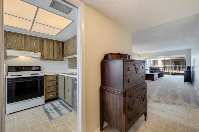 kitchen with white range with electric cooktop, sink, and light tile floors