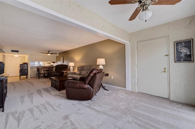 living room with light colored carpet and ceiling fan