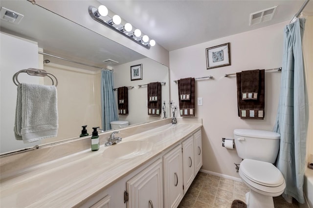 full bathroom with toilet, tile floors, shower / tub combo with curtain, and vanity with extensive cabinet space