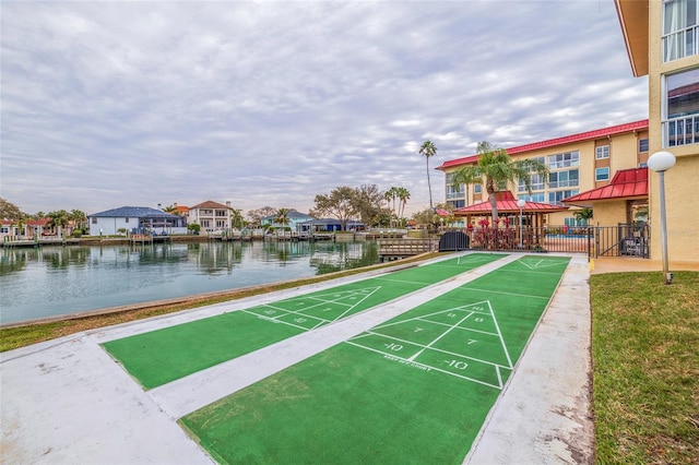 view of nearby features with a water view and a lawn