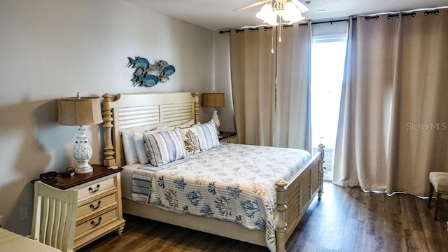 bedroom featuring dark hardwood / wood-style floors and ceiling fan