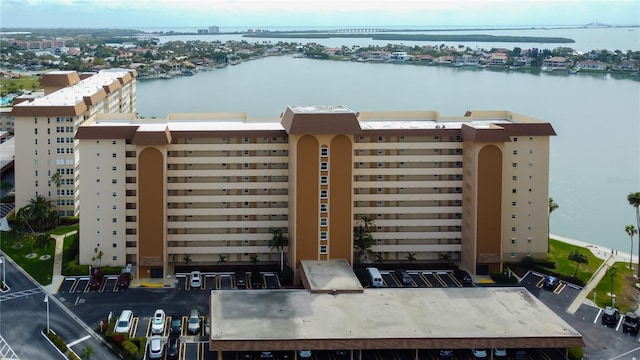 drone / aerial view featuring a water view and a city view