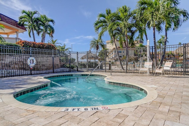 view of pool featuring a patio area, fence, and a pool