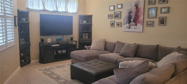 tiled living room featuring a healthy amount of sunlight