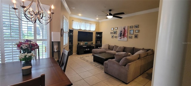 tiled living room featuring ornamental molding, ceiling fan with notable chandelier, and a wealth of natural light