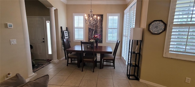 tiled dining space with a notable chandelier and ornate columns