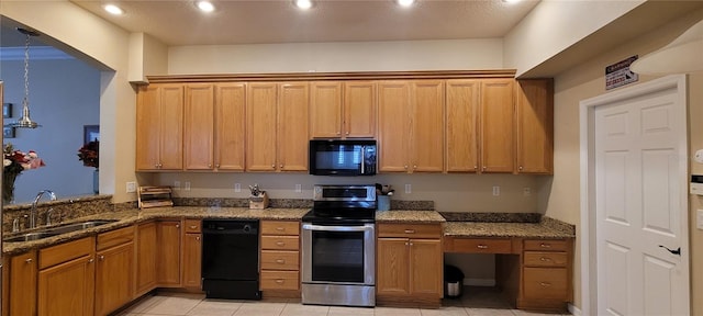 kitchen with dark stone counters, light tile flooring, black appliances, and sink