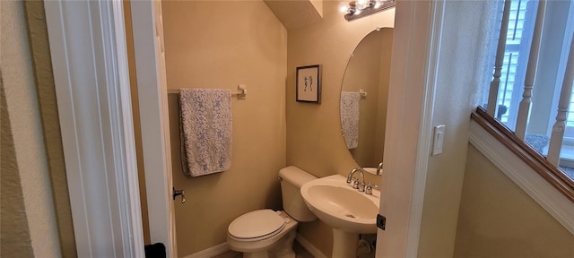 bathroom featuring toilet and sink