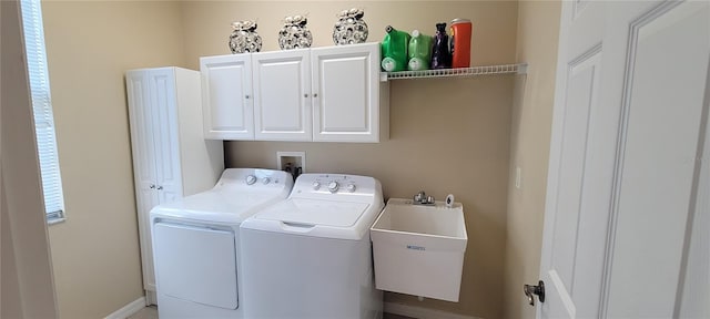 laundry area featuring hookup for a washing machine, cabinets, separate washer and dryer, and sink