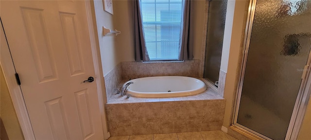 bathroom with tile floors and separate shower and tub