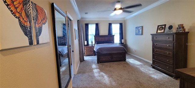 carpeted bedroom with crown molding and ceiling fan