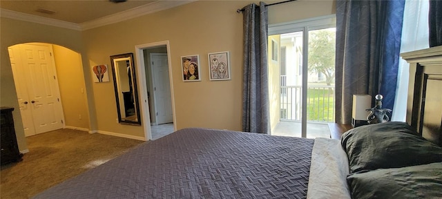 carpeted bedroom featuring access to outside and crown molding