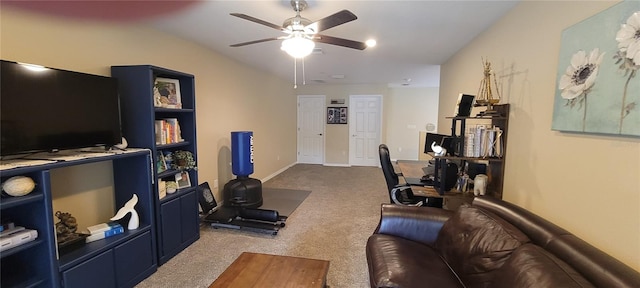 interior space with ceiling fan and dark carpet