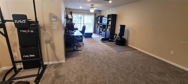 exercise area with light colored carpet and ceiling fan