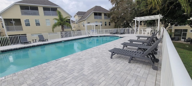 view of swimming pool with a pergola and a patio area