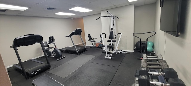 workout area with a paneled ceiling