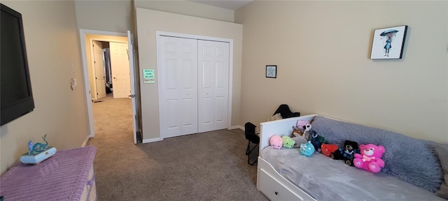 bedroom with dark carpet and a closet