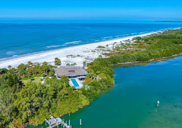 aerial view featuring a water view and a view of the beach