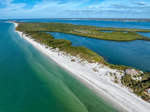 bird's eye view with a beach view and a water view