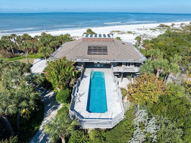 birds eye view of property featuring a water view and a view of the beach