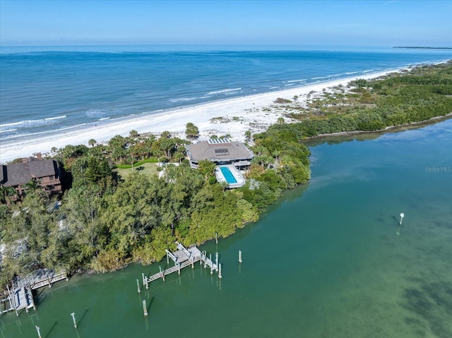 birds eye view of property featuring a view of the beach and a water view