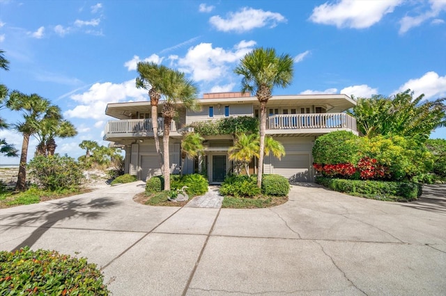 view of front of house with a balcony and a garage