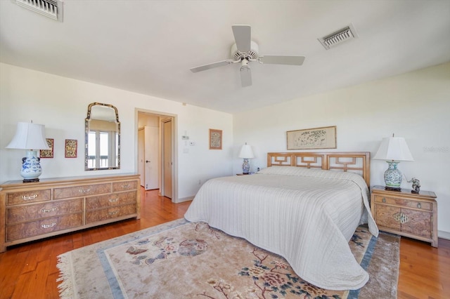 bedroom with wood-type flooring and ceiling fan