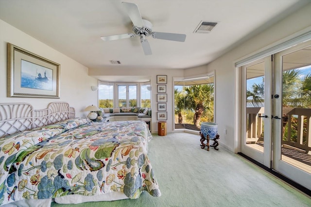 bedroom with light carpet, french doors, ceiling fan, and access to outside