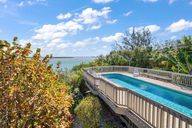 view of pool featuring a water view