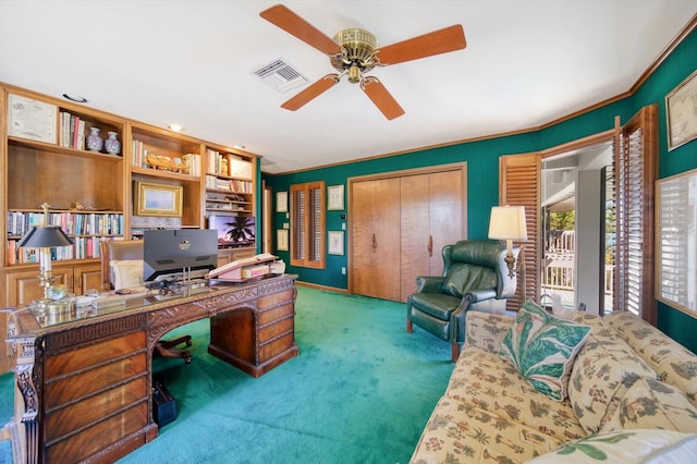 office featuring ceiling fan and dark carpet