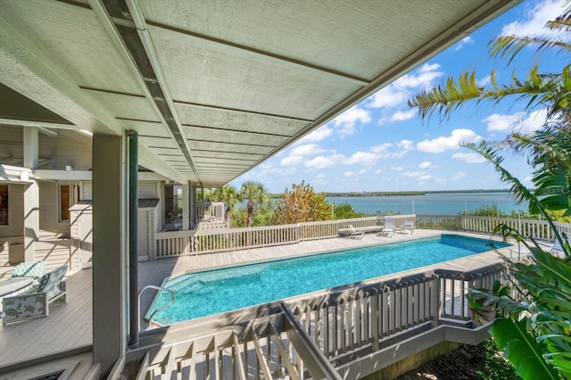 view of pool with a deck with water view