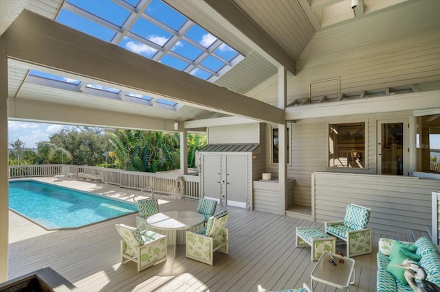 view of swimming pool featuring a wooden deck