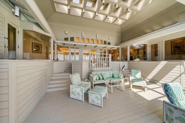 wooden terrace featuring outdoor lounge area