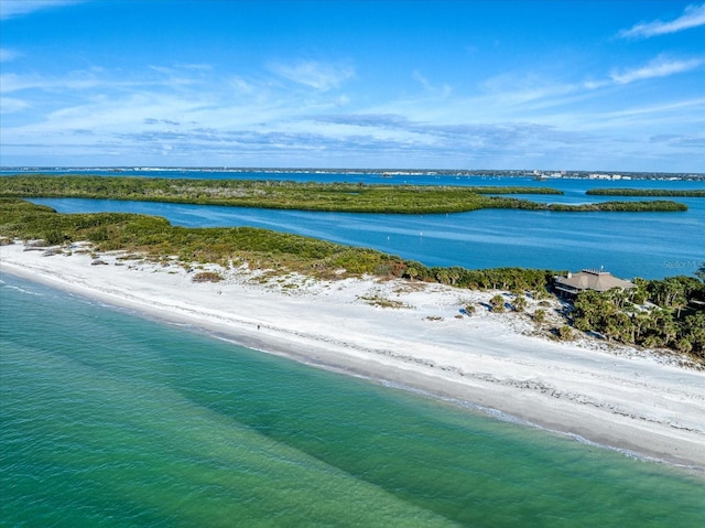 bird's eye view with a beach view and a water view