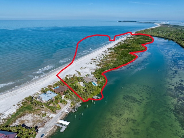 bird's eye view featuring a beach view and a water view