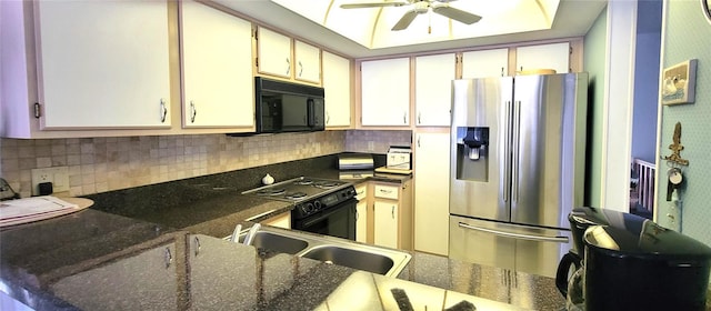 kitchen with backsplash, ceiling fan, sink, black appliances, and dark stone countertops