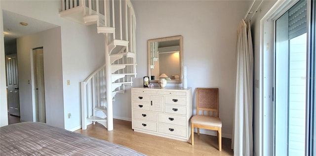 bedroom featuring light hardwood / wood-style flooring and a closet