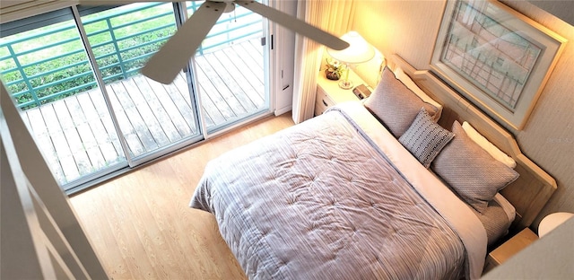 bedroom with multiple windows and light hardwood / wood-style floors