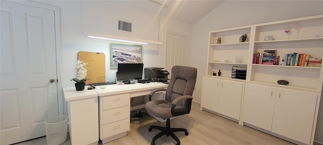 office featuring light hardwood / wood-style floors and lofted ceiling