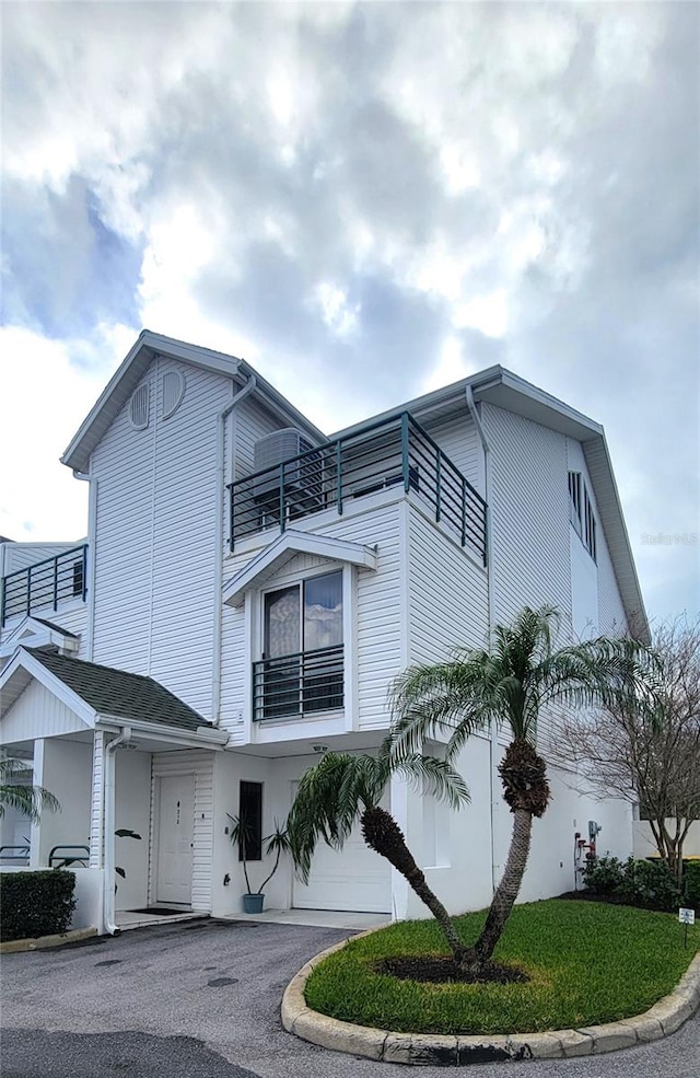 view of front of property with a balcony