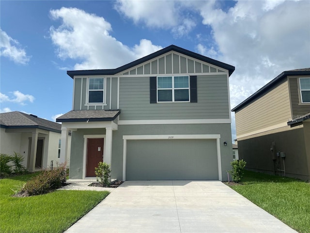 view of front of house featuring a front lawn and a garage