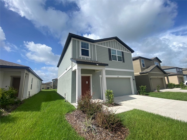 view of front of property featuring a front yard and a garage