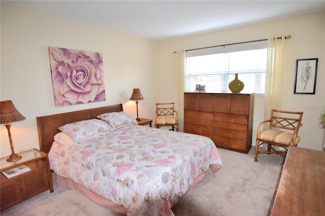 bedroom featuring light carpet