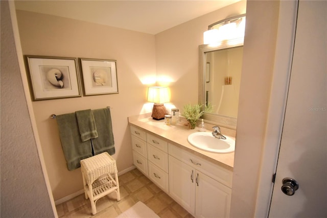 bathroom featuring tile floors and vanity