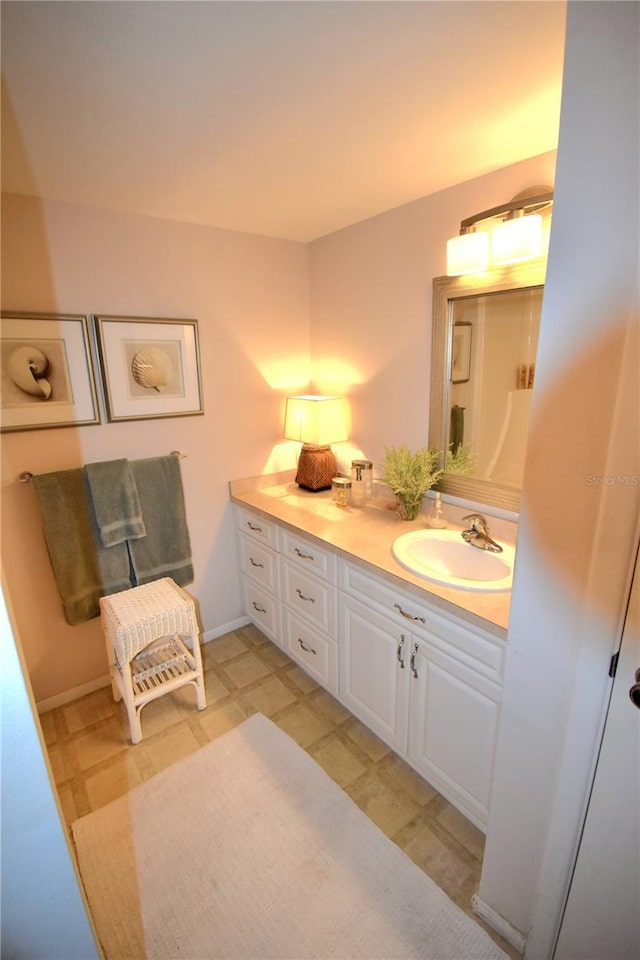 bathroom with vanity and tile floors